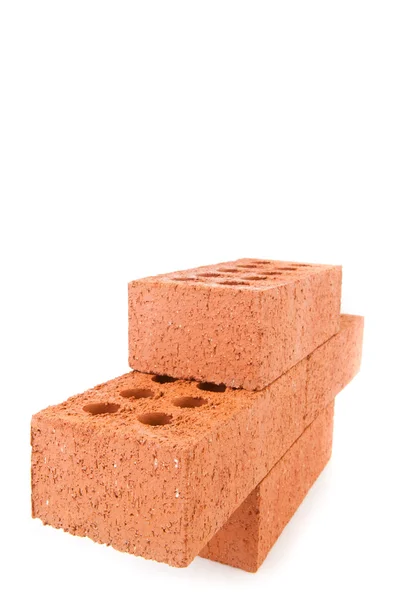 Quatro tijolos de argila do lado empilhados como uma parede — Fotografia de Stock