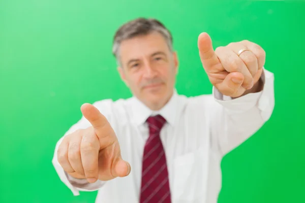 Man pointing with both hands — Stock Photo, Image