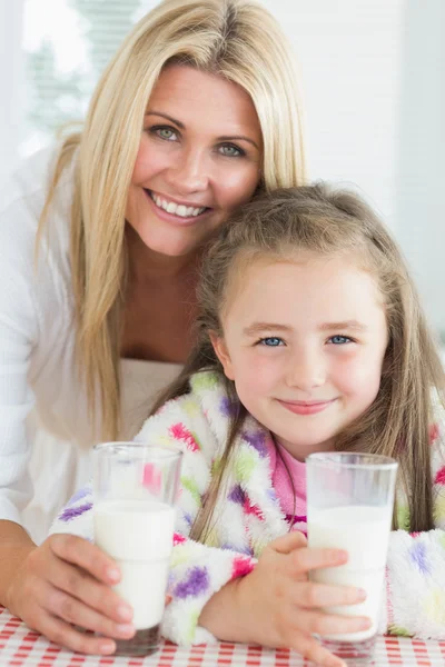 Mother and girl drinking milk — Stock Photo, Image