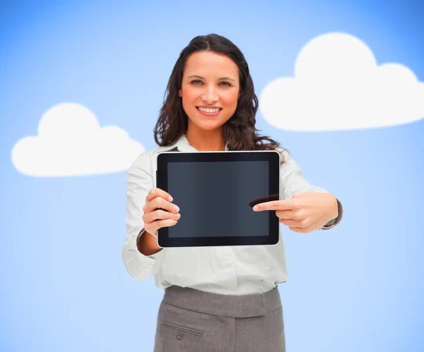 Businesswoman pointing to her digital tablet — Stock Photo, Image