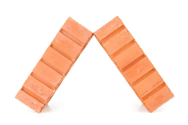 Two clay bricks leaning against each other — Stock Photo, Image