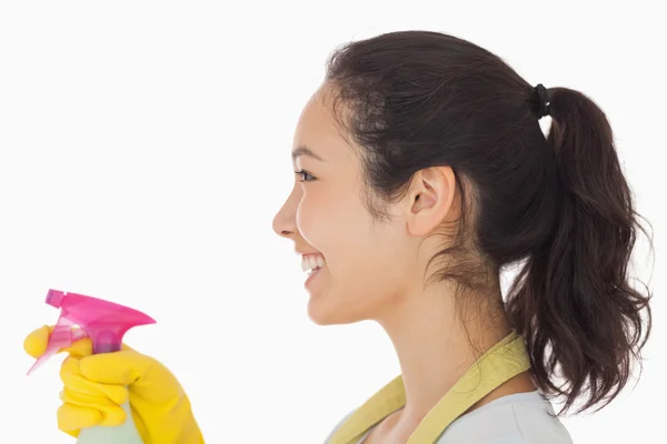 Cheerful woman using a window cleaner — Stock Photo, Image