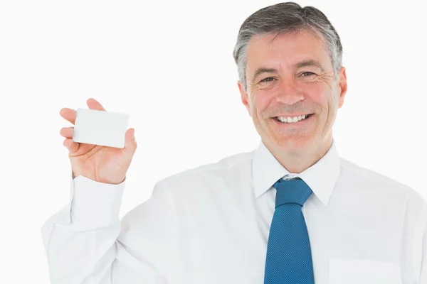 Smiling man with business card — Stock Photo, Image