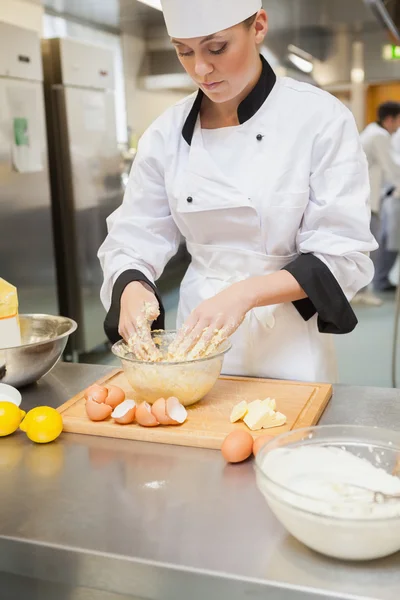 Baker mixing dough — Stock Photo, Image