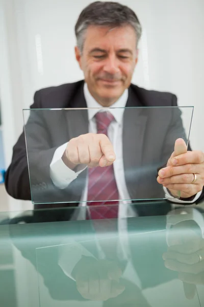 Smiling man touching on a virtual screen — Stock Photo, Image