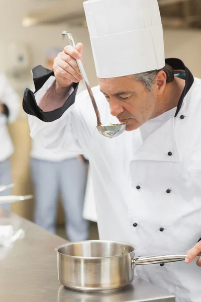 Chef tasting soup — Stock Photo, Image