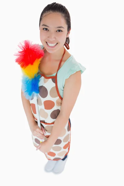 Happy woman holding duster — Stock Photo, Image