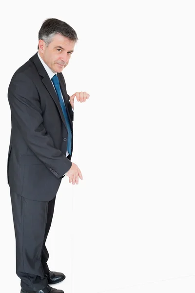 Smiling man holding white board — Stock Photo, Image