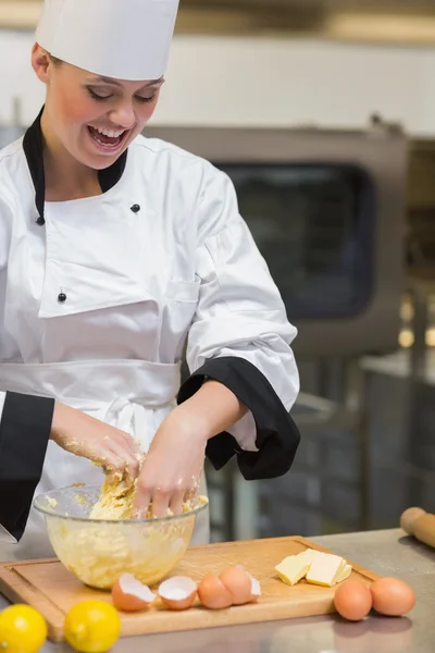 Pastry chef mixing dough — Stock Photo, Image