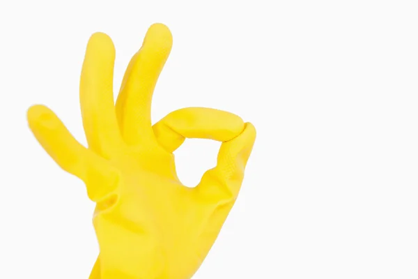 Hand in glove showing ok symbol — Stock Photo, Image