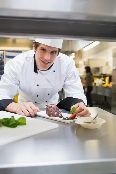 Chef putting mint on his plate — Stock Photo, Image