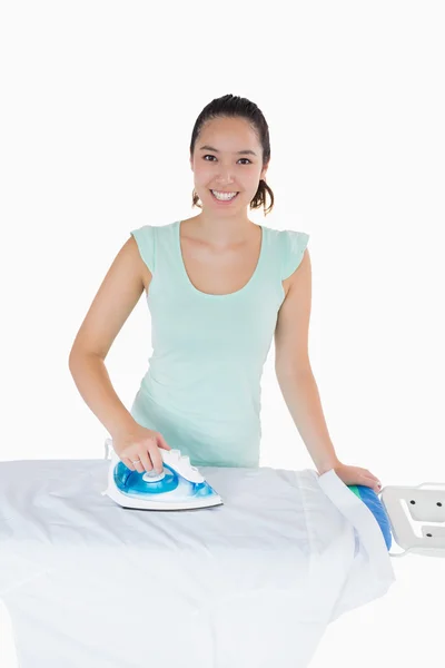 Smiling woman ironing — Stock Photo, Image