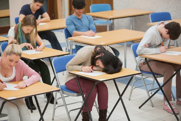 Girl sleeping during exam — Stock Photo, Image