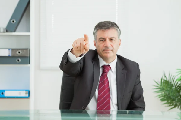 Business man pointing seriously — Stock Photo, Image