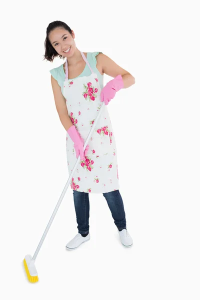 Happy woman sweeping floor — Stock Photo, Image