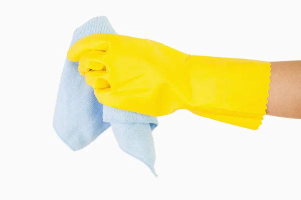 Uitgestrekte hand in de handschoen bedrijf rag — Stockfoto