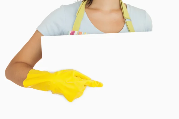 Gloved hand pointing on white plate — Stock Photo, Image