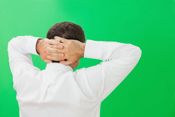 Businessman with hands on back of head — Stock Photo, Image