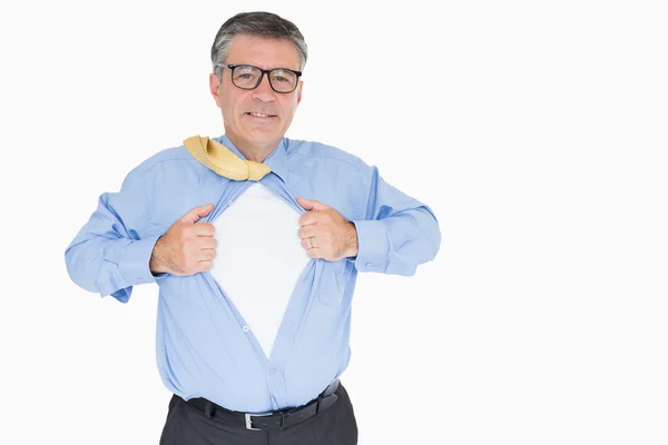 Happy man with glasses is pulling his shirt with his hands — Stock Photo, Image