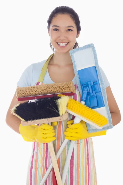 Woman holding mops and brushes — Stock Photo, Image