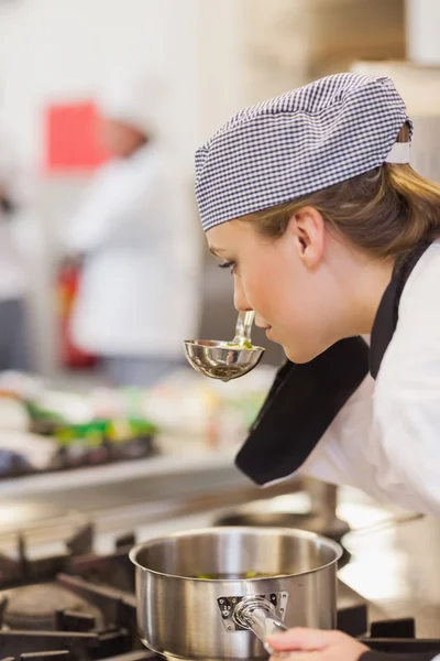Chef smelling her soup — Stock Photo, Image