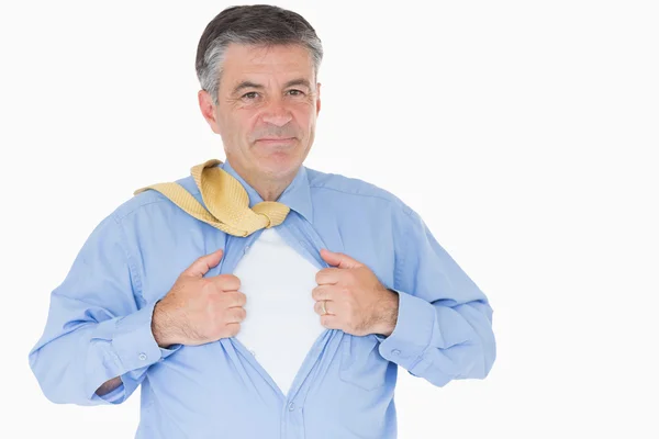 Businessman opening shirt like superhero — Stock Photo, Image