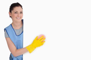 Smiling cleaner washing with a sponge clipart