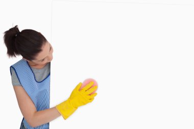 Maid washing with a sponge clipart