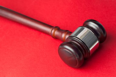 Gavel on a red background clipart