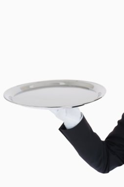 White gloved hand holding a silver tray clipart