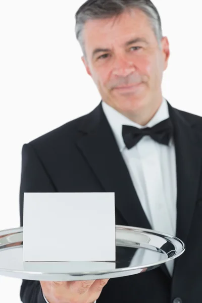 Waiter holding tray with paper — Stock Photo, Image