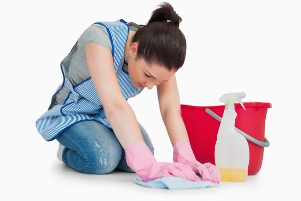 Serious cleaning woman wiping up the floor — Stock Photo, Image