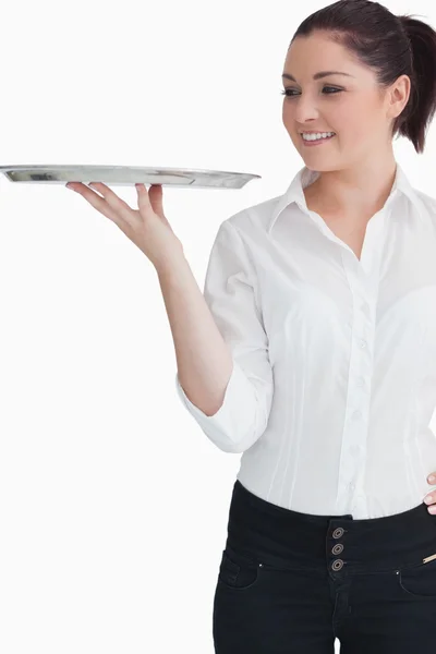 Young woman looking at the tray — Stock Photo, Image