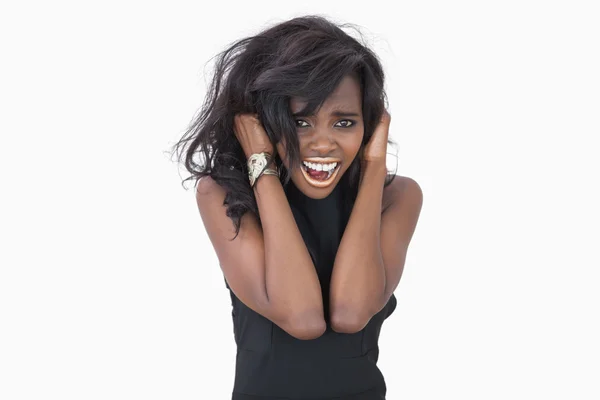 Woman standing hands in hair — Stock Photo, Image