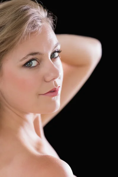 Blonde woman holding her hair — Stock Photo, Image