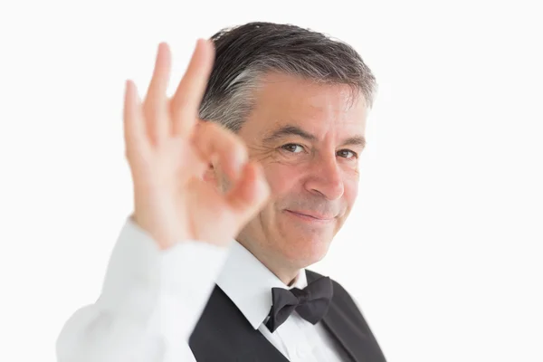 Well-dressed waiter making ok sign — Stock Photo, Image