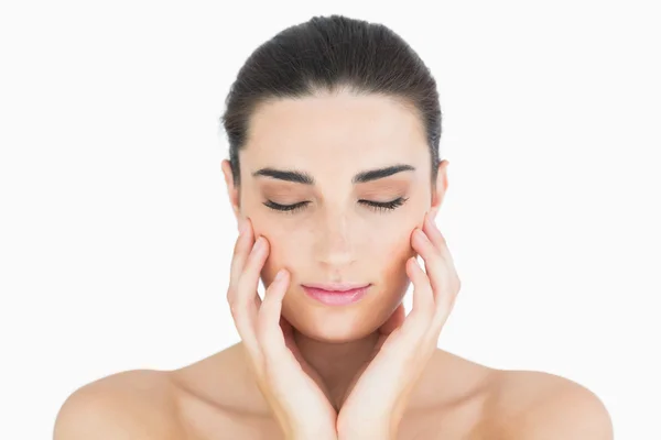 Woman touching her chin while looking natural — Stock Photo, Image