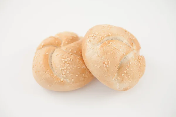Sesame buns leaning on each other — Stock Photo, Image