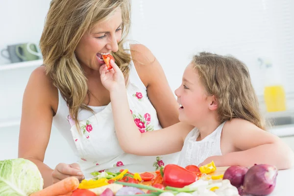 Daughter feeding her mother — Stock Photo, Image