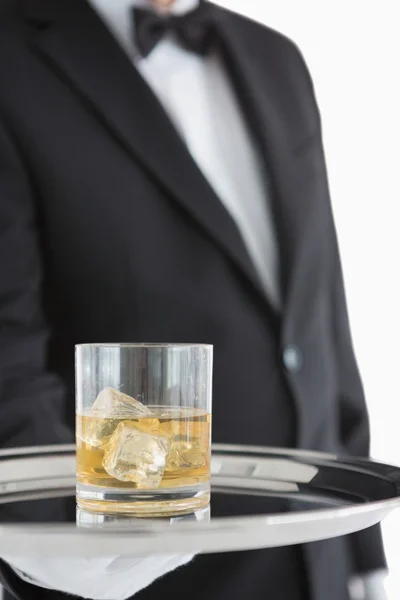 Man holding tray with whiskey — Stock Photo, Image