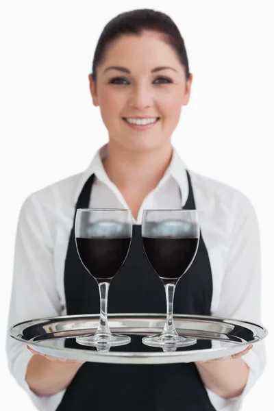 Waitress holding two glasses of wine — Stock Photo, Image