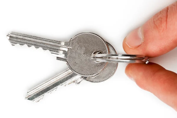 Finger holding set of keys — Stock Photo, Image