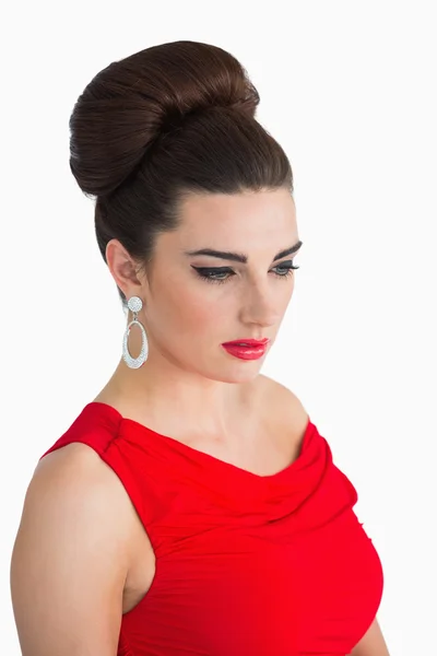 Woman wearing red dress and looking away — Stock Photo, Image