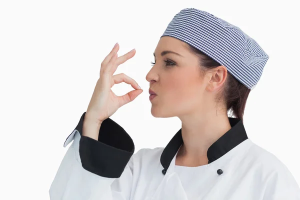 Chef making sign for tasty with her hands — Stock Photo, Image