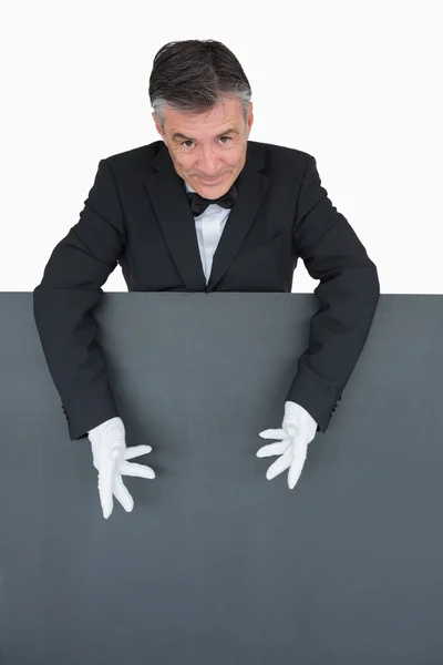 Waiter showing the grey board — Stock Photo, Image