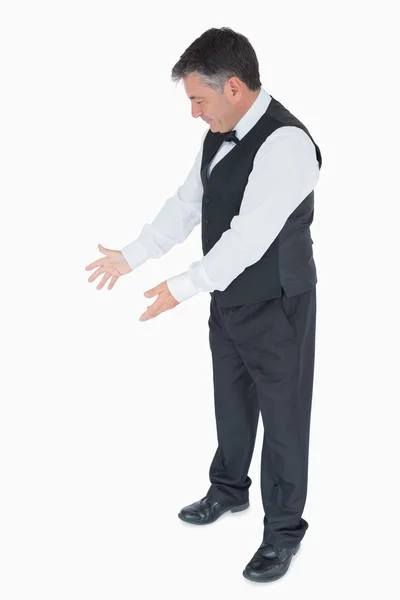 Waiter showing something — Stockfoto