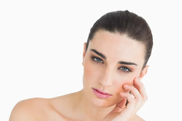 Pale looking woman touching her face — Stock Photo, Image