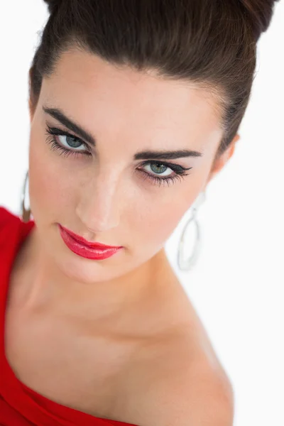 Woman in red dress looking at camera — Stock Photo, Image