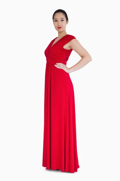 Smiling woman in red dress — Stock Photo, Image