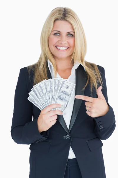 Счастливая хорошо одетая женщина с долларами — стоковое фото